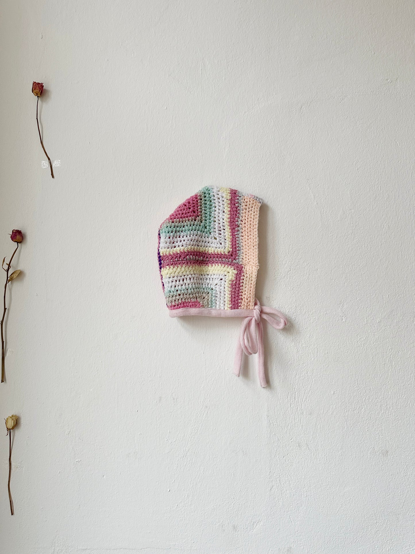 Pastel coloured crocheted knitted bonnet