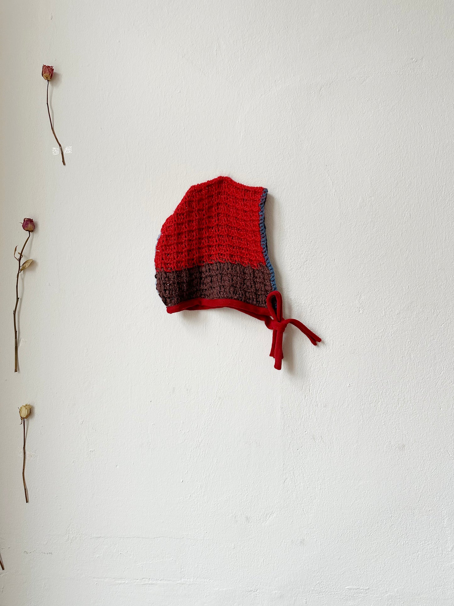 Billie Blanket Cap in red and brown, vintage crochet style, ideal for cooler months, made from unique Scottish textiles.