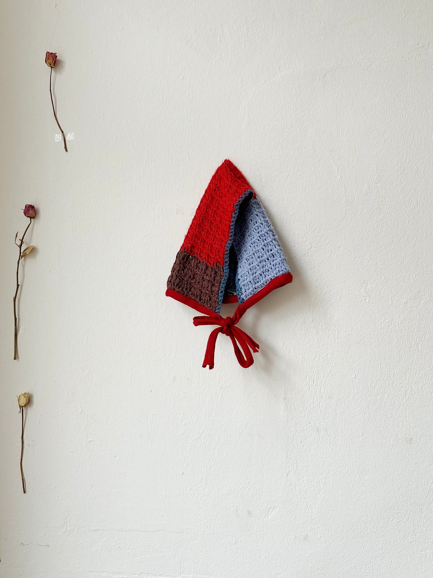 Billie Blanket Cap in red and blue, vintage knitted style, perfect for cooler months, handwash recommended.