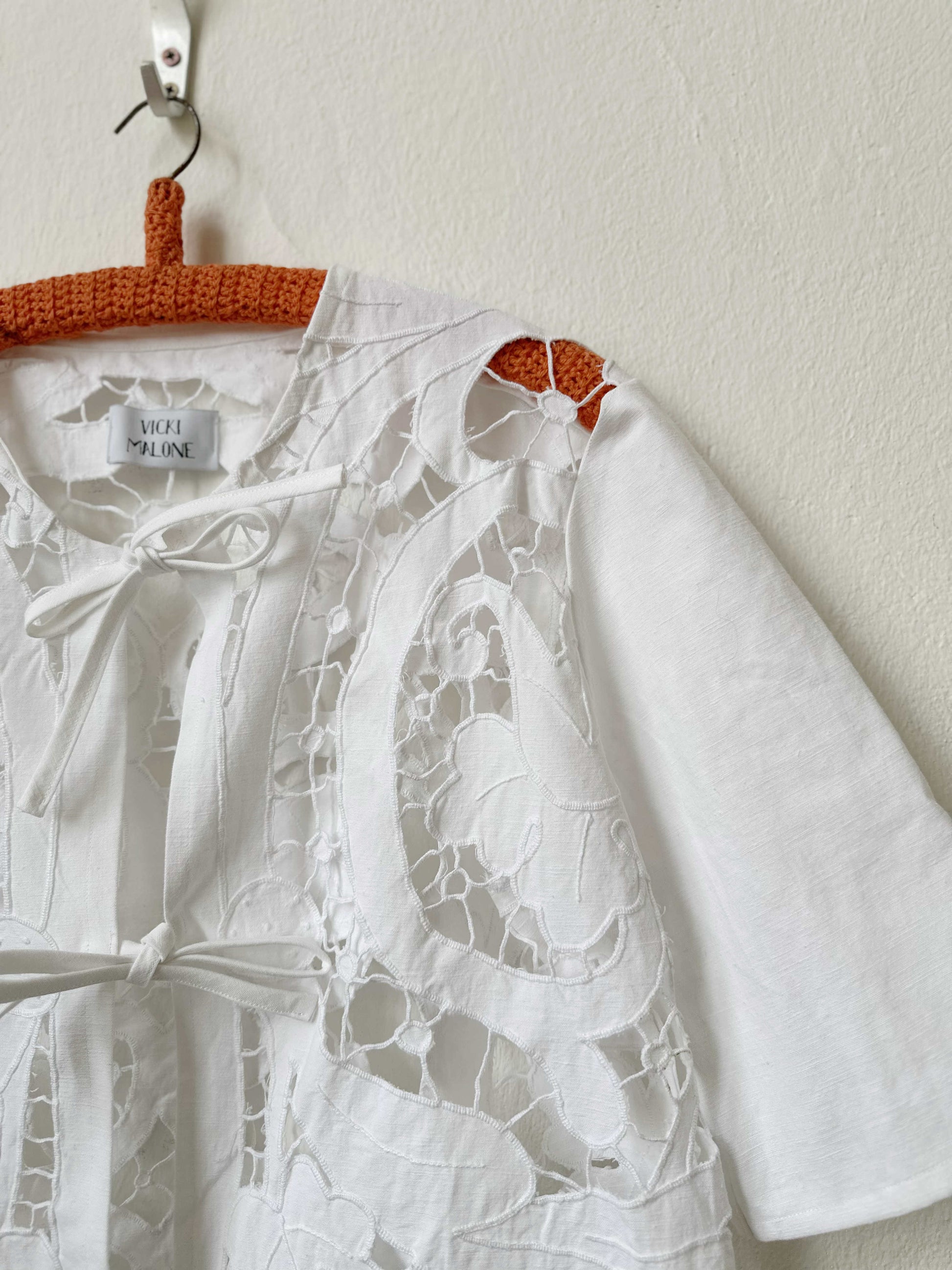 Handmade vintage lace blouse with pom pom hem detail, short sleeves, made from a Bologna thrift store curtain