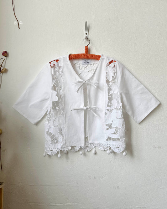 Handmade small vintage lace blouse with pom pom hem and front panel detail, made from a Bologna curtain
