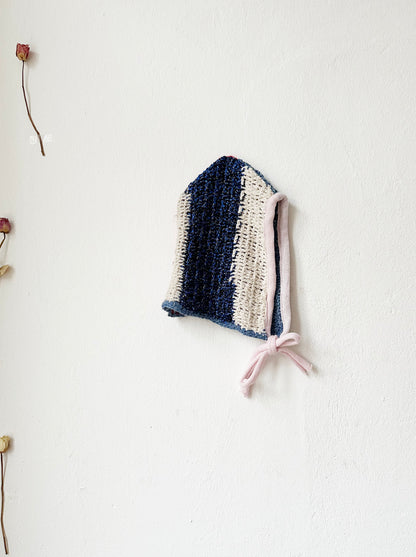 Crochet bonnet with blue lurex shine stripe and pink trim.