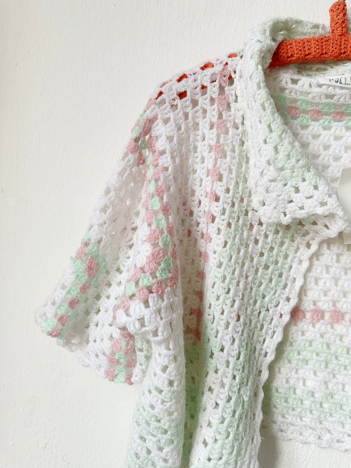 Close up view of the crochet blanket jacket.