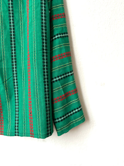 Green shirt with black and red stripes on a white background