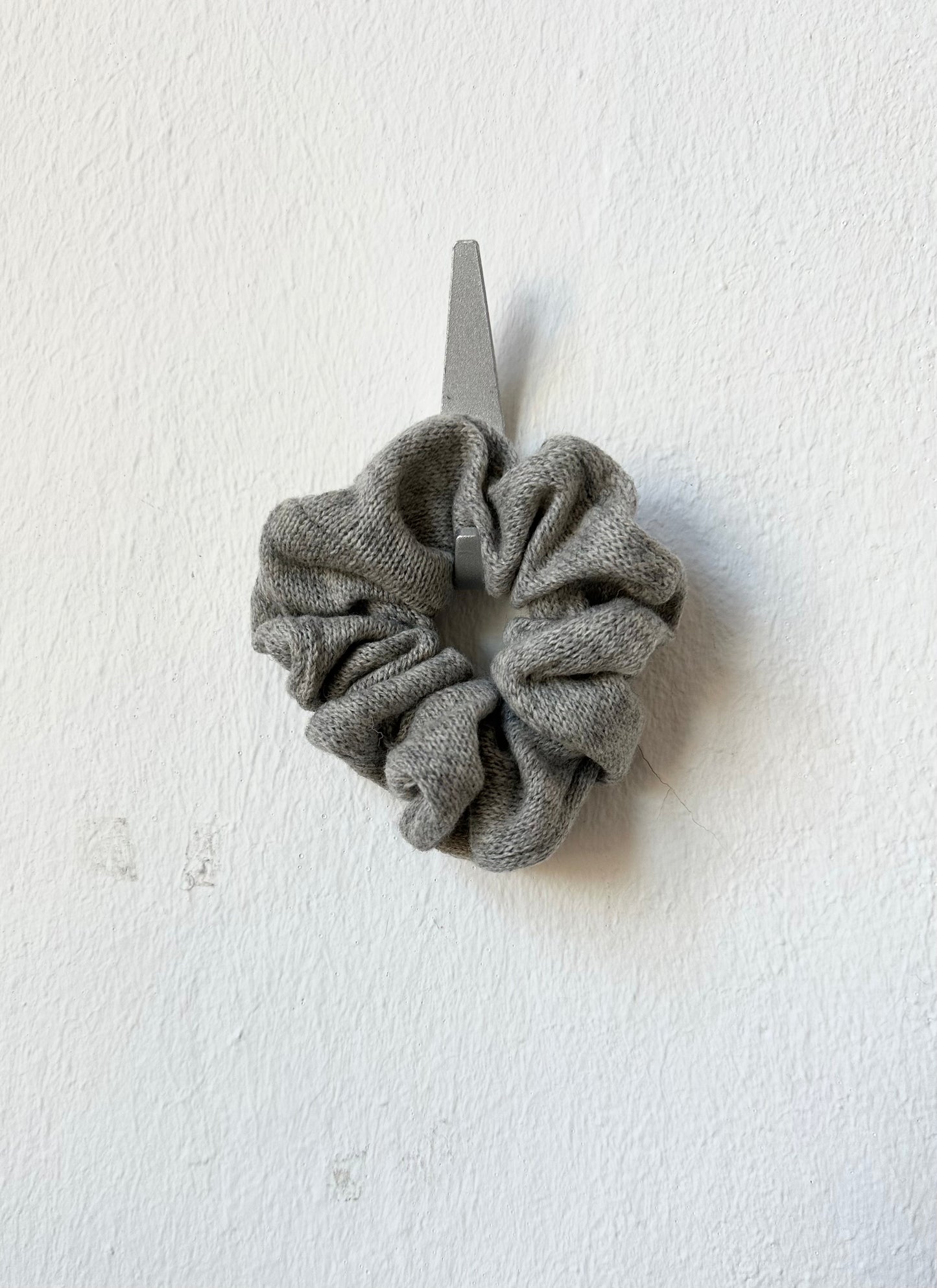 Gray scrunchie on a white background