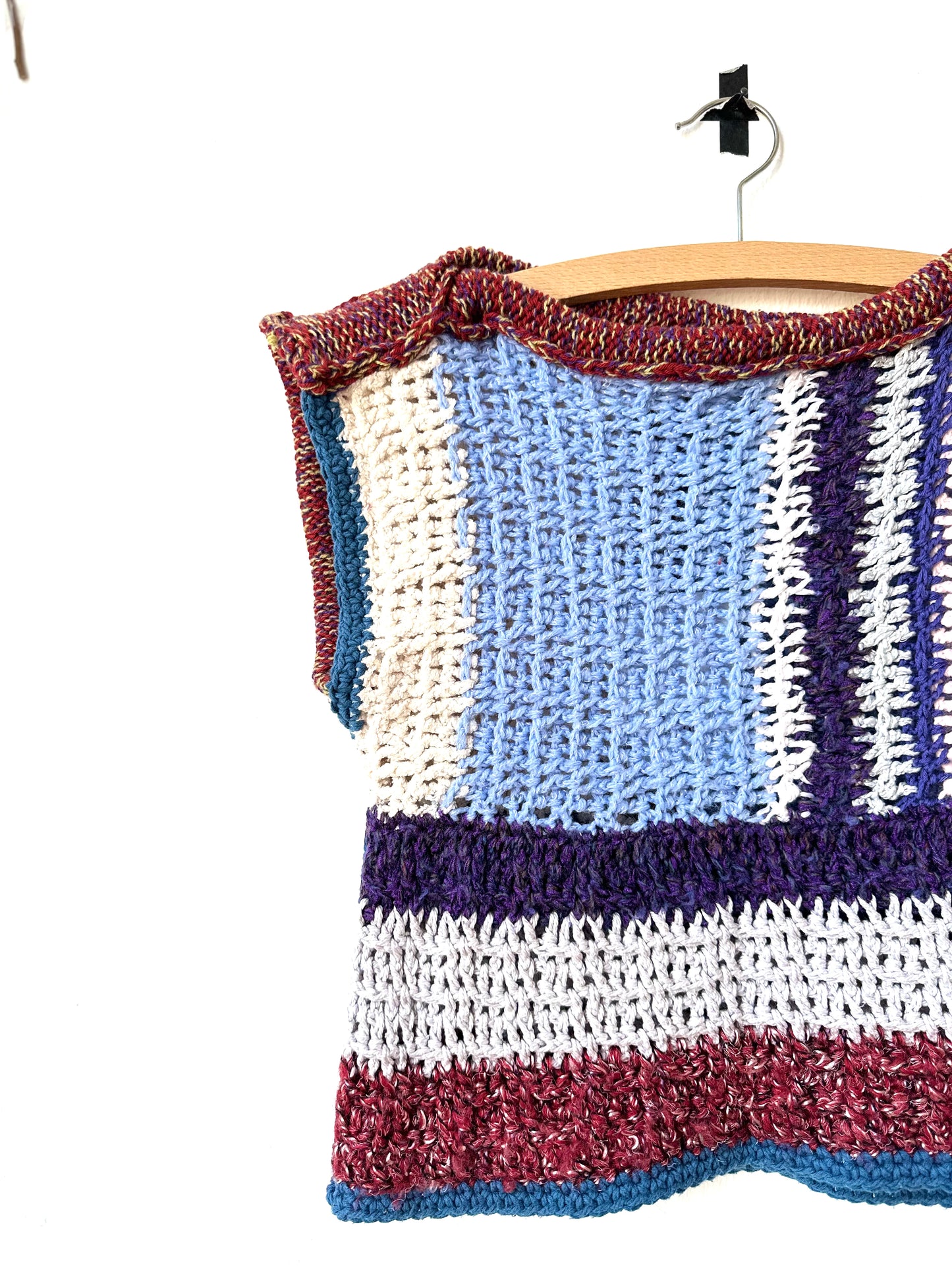 Close view of a blanket vest in stripe pattern.