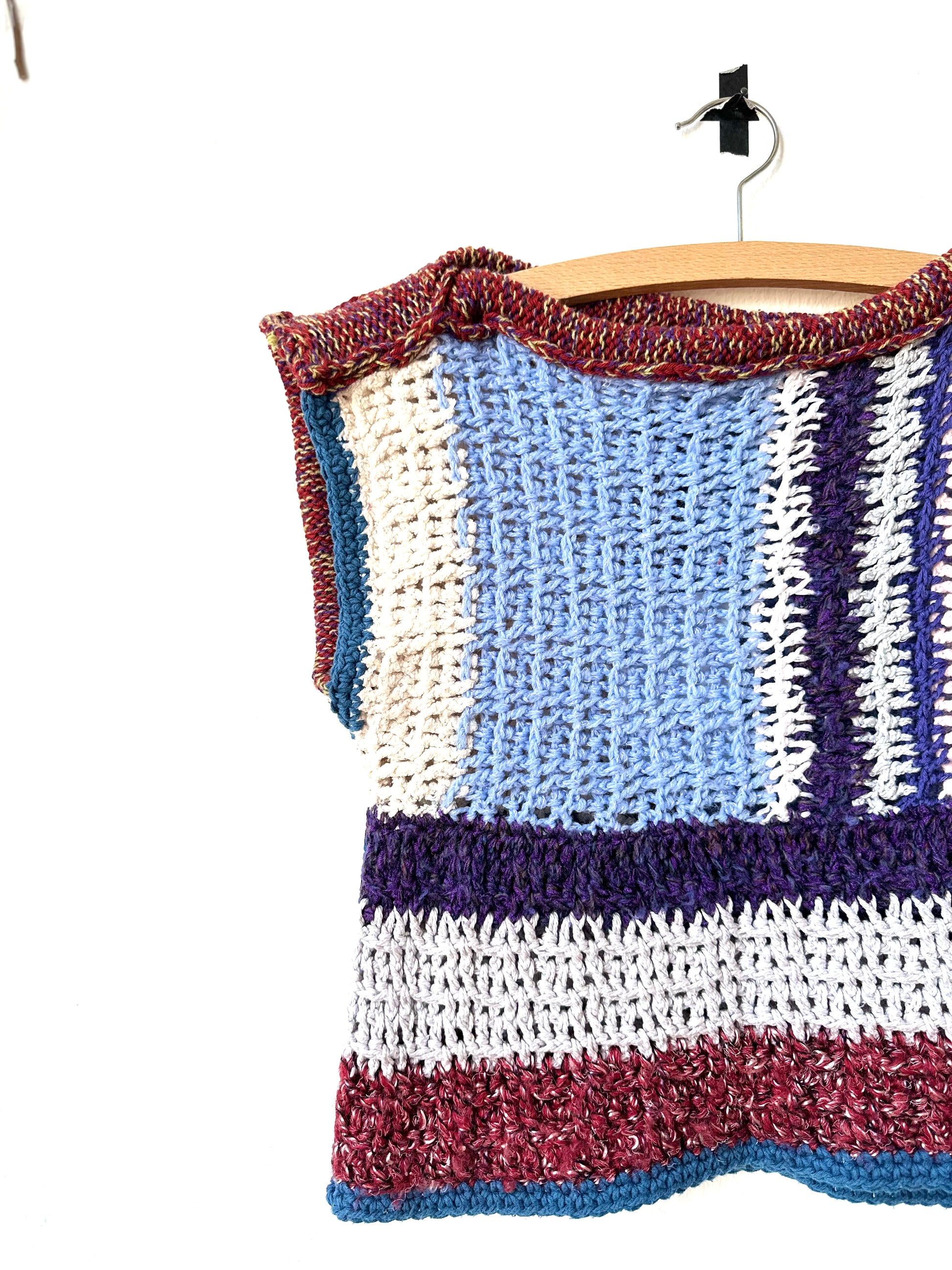 Close view of a blanket vest in stripe pattern.