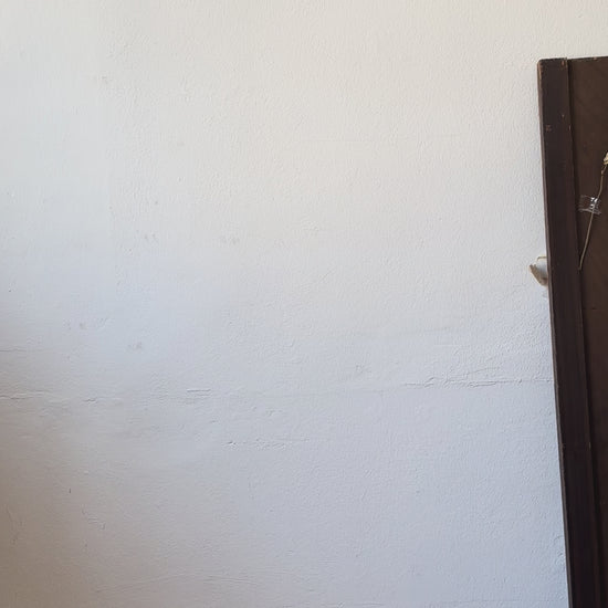 Vicki wears an upcycled tablecloth blouse with pink embroidery.