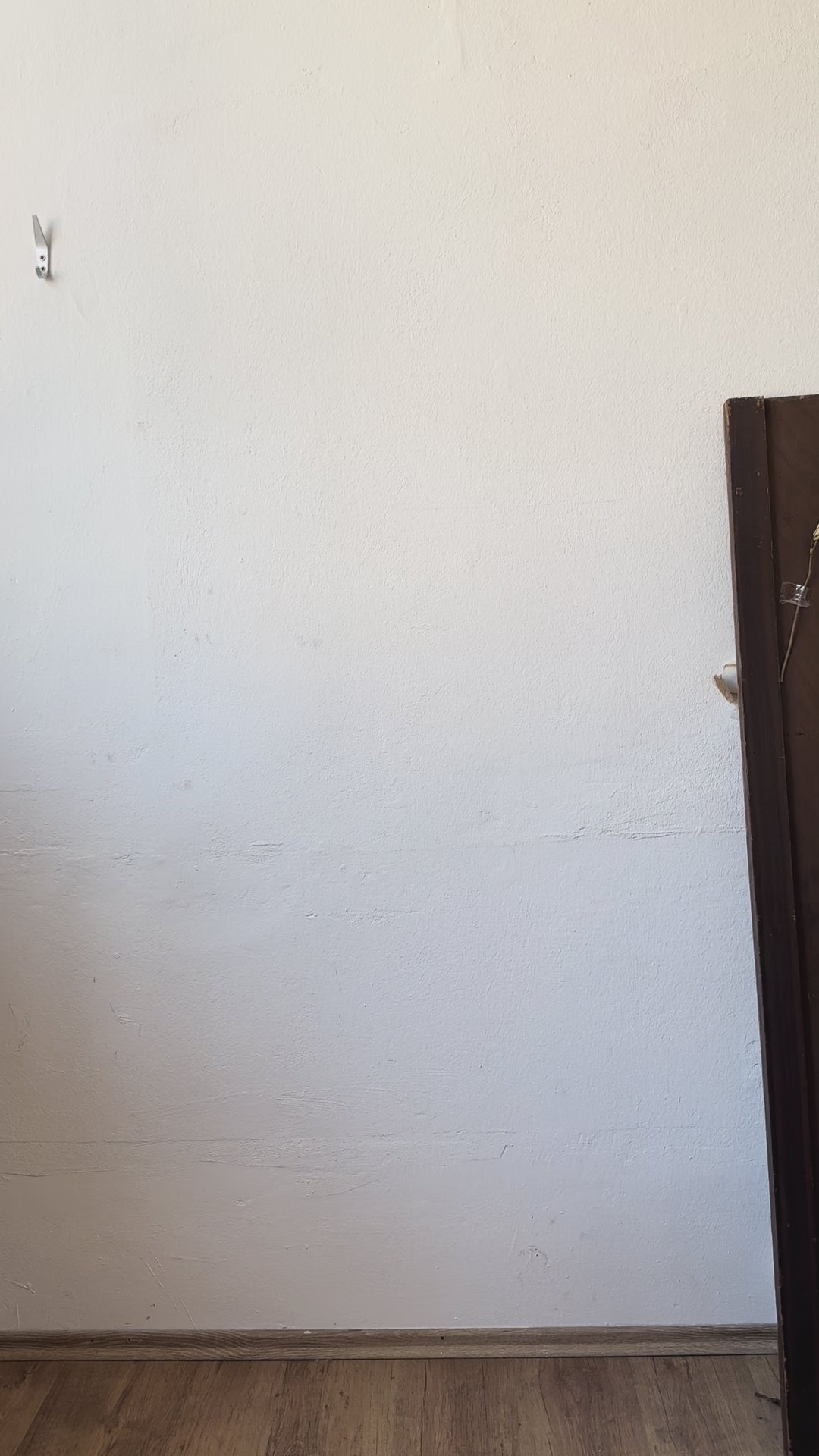 Vicki wears an upcycled tablecloth blouse with pink embroidery.